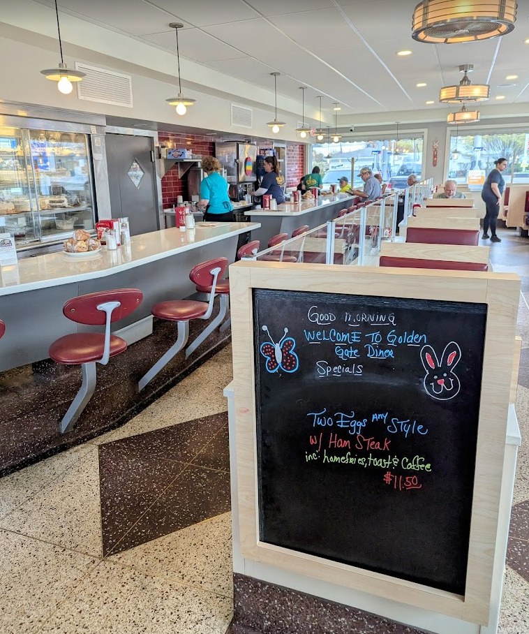 Inside Golden Gate Diner with its classic counter, stools, and booths